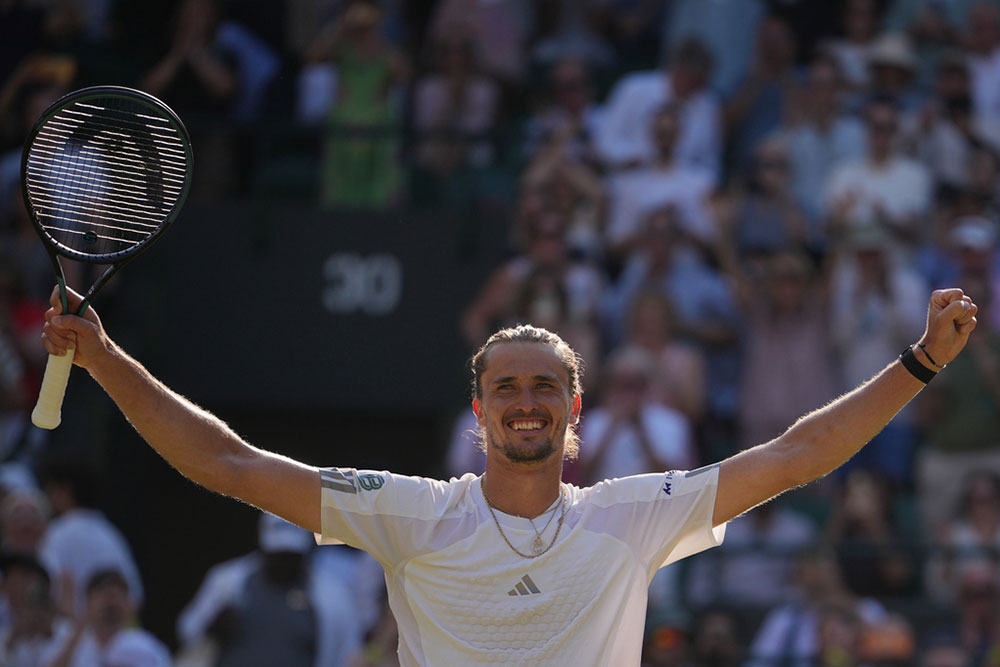 | Photo: AP/Kin Cheung : Alexander Zverev of Germany celebrates winning against Taylor Fritz of the United States in their quarter-final men's singles match at the Wimbledon Tennis Championships in London.